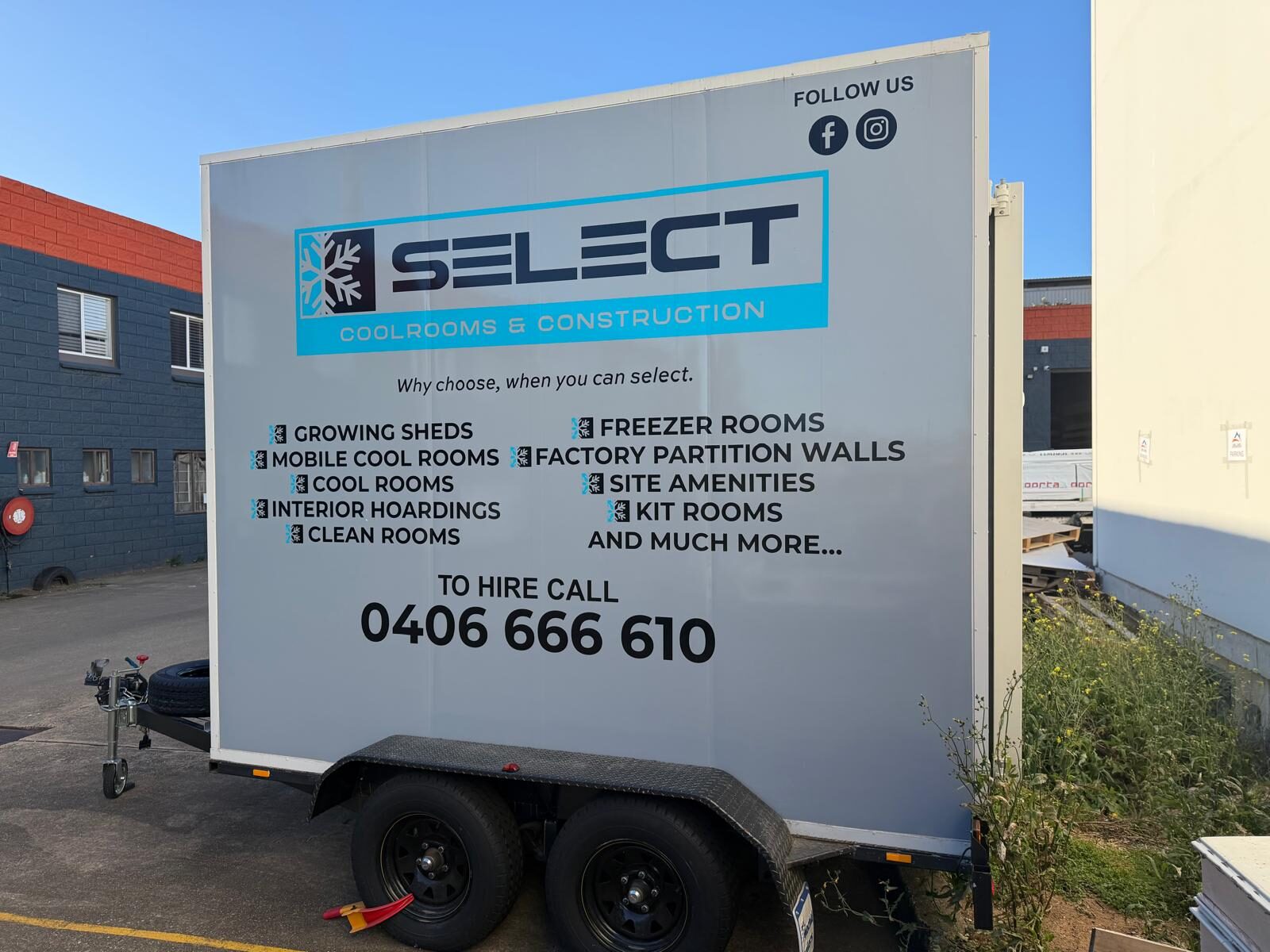 A Select Mobile Coolrooms trailer in side profile, showing the full Select Coolrooms & Construction livery, tandem-axle running gear and tow hitch